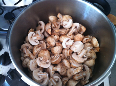 Raw mushrooms in pressure cooker